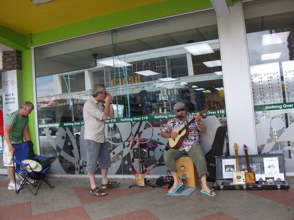 Rob playing harp with busker!