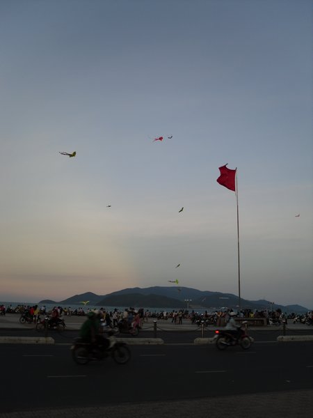 Most nights people fly their kites at the beach