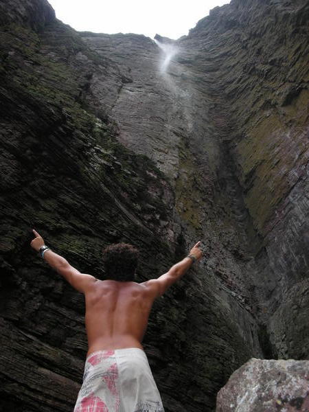 heroic pose looking up to 400m+ waterfall
