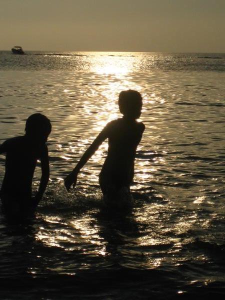 children playing at sunset
