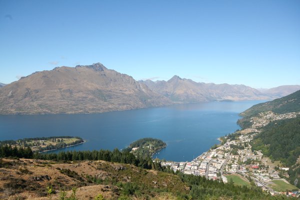 View of Queenstown with lake behind