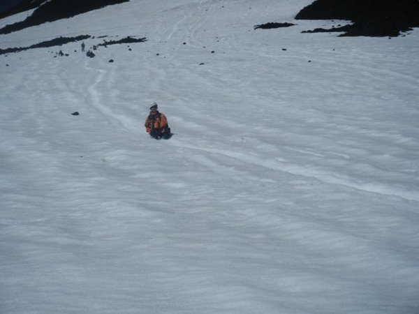 me sliding down the glacier field