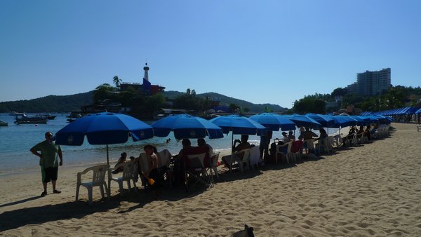 Caleta beach overrun with furniture