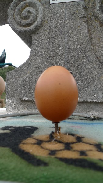 egg balanced on a nail