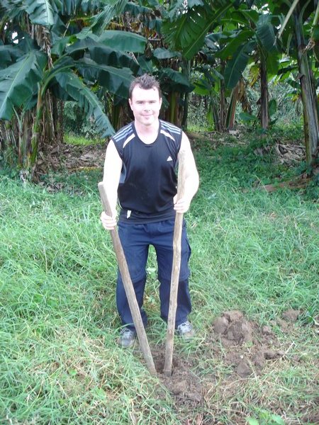 Attempting to dig holes for banana trees