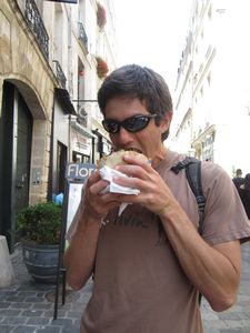 YUM, Michael chomps on his falafel and lamb pita