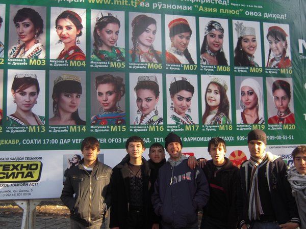 hanging out in front of the miss tajikistan sign-board