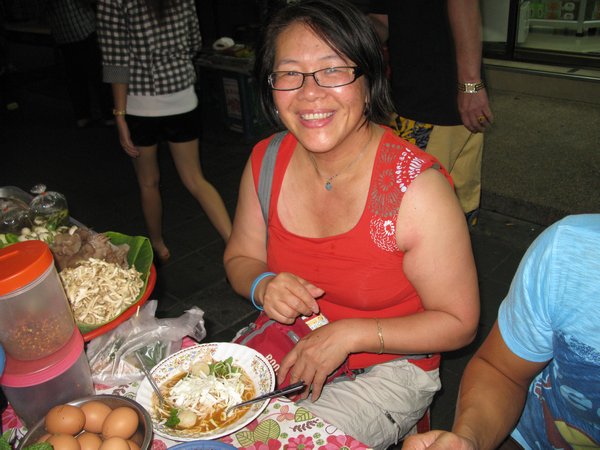 Lilan enjoying her Laotiane Noodle soup around Silom Road