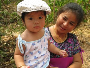 Youg Thai girl with her mother at the Fall