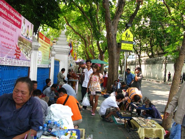 Street vendors across from the Grand Palace