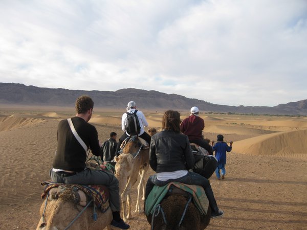 Riding camels out the desert