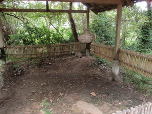One of the many pits where a mass grave was discovered and excavated