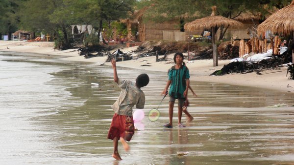 Children play on Otres beach