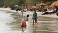 Children play on Otres beach