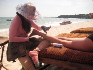 Jeni being tortured on beach, Sihanoukville