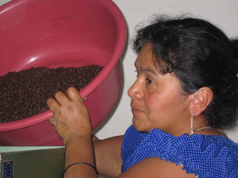 dumping beans into the grinder