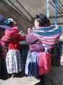 Women carry their wares on their back in brightly coloured cloths