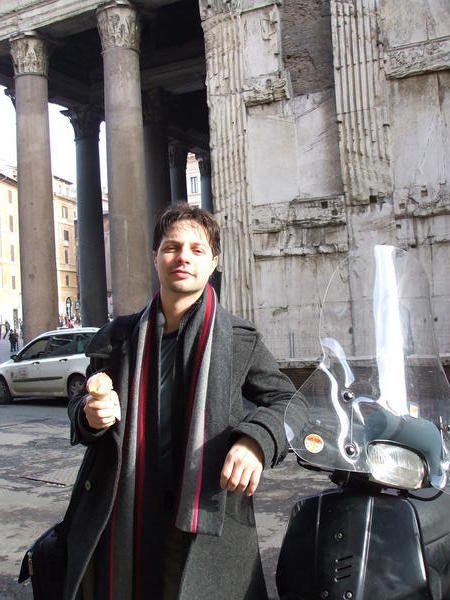giovanni leaning on a vespa with his gelato