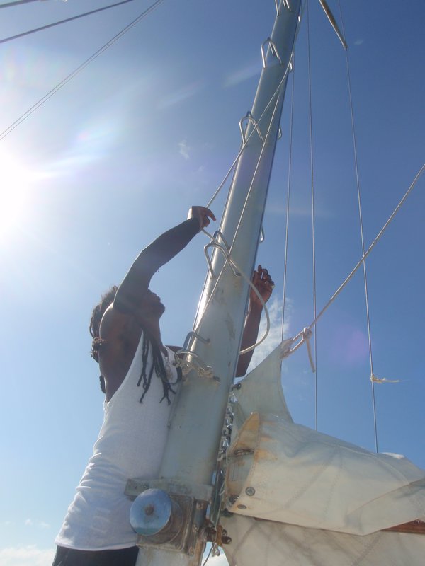 Ellis hoisting the mainsail