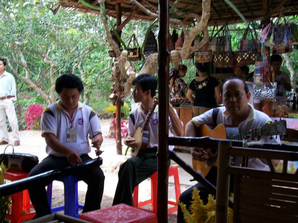 Traditional Vietnamese music with fruit snack on Delta tour