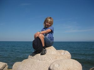 Phoebe on the rocks in Piran