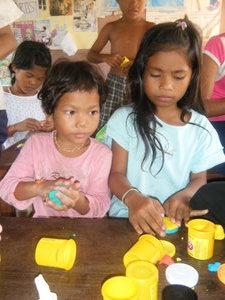 Playing with play-doh provided by the other volunteers