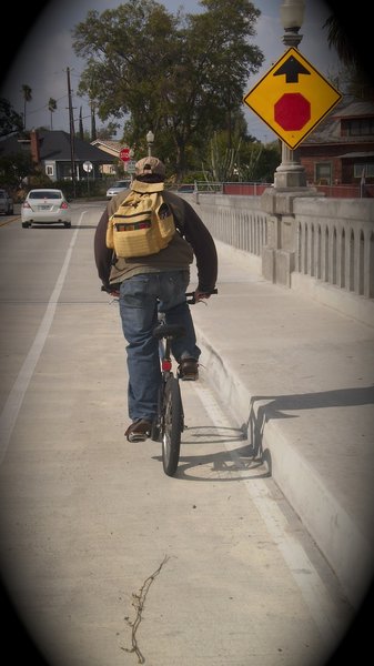 Aaron riding bike in Riverside, CA