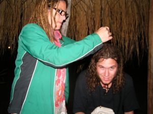 30-My Argentinian friend Mane putting a dred in my hair
