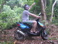 Marcos proving that he can ride a scooter in the jungle.