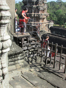 Angkor Wat: Tourist Frozen at the top of the steep steps... it's a long way down