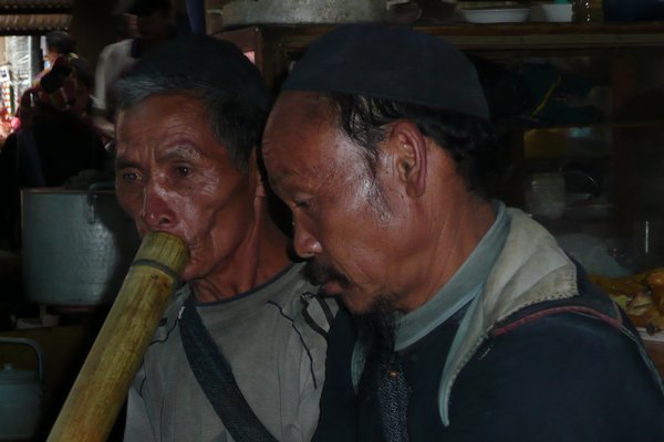 Sucking on the hookah pipe