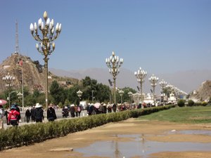 people circumambulating Potala Palace