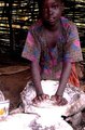 girl grinding grains to make flour