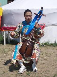 Buryat musician banging out the tunes on the old horsehair fiddle