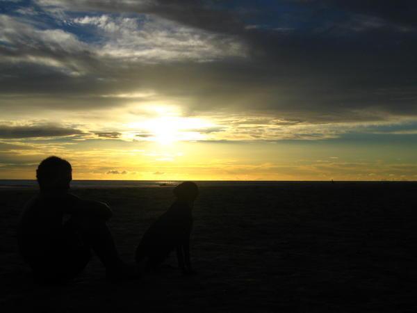Sun set, with man and dog.