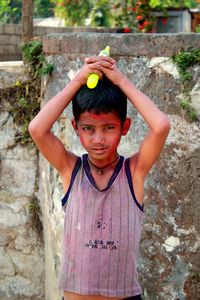 Boy playing Holi