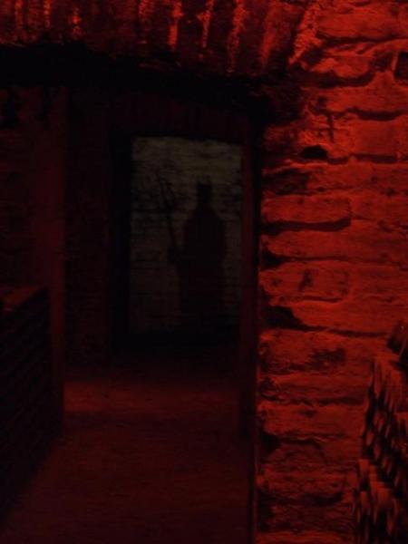 The silhouette of the devil in the old cellar.