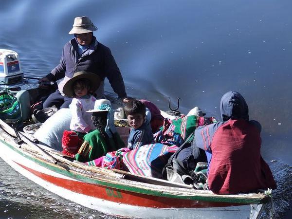 Family in a boat on Lake Titicaca.