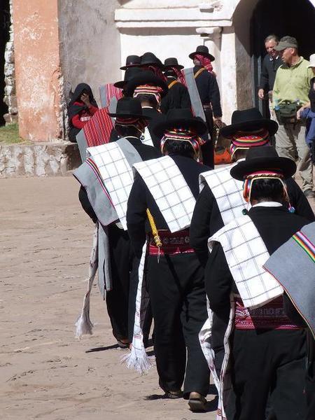 A procession in the village square.