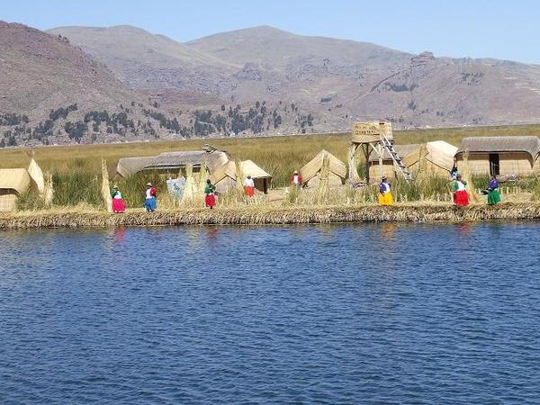 The local women await us on the dock of Khantati reed island.