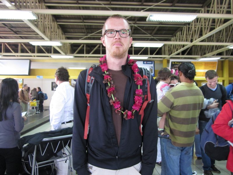 Xan not looking at all uncomfortable in a flower garland.