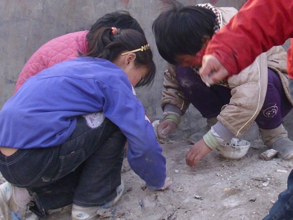 Children playing in the dirt