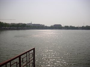 view across lake with needle in the background