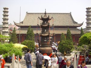 in front of the hall of  the laughing buddha