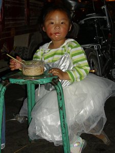 little girl enjoying her noodles
