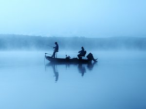 A bass boat at dawn