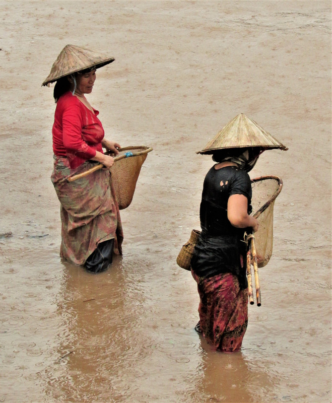 Women shrimping as the waters rise