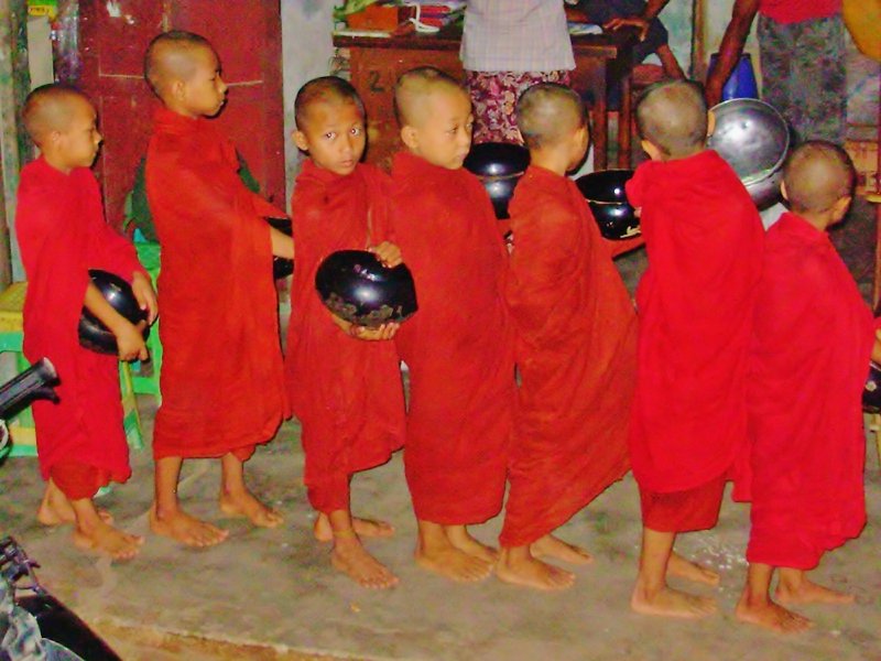 Young monks queue for alms at dawn, Bagan