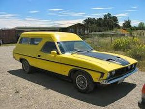 A 1976 Ford Falcon panel wagon. This one bearing a go-faster stripe but no roo-bars.