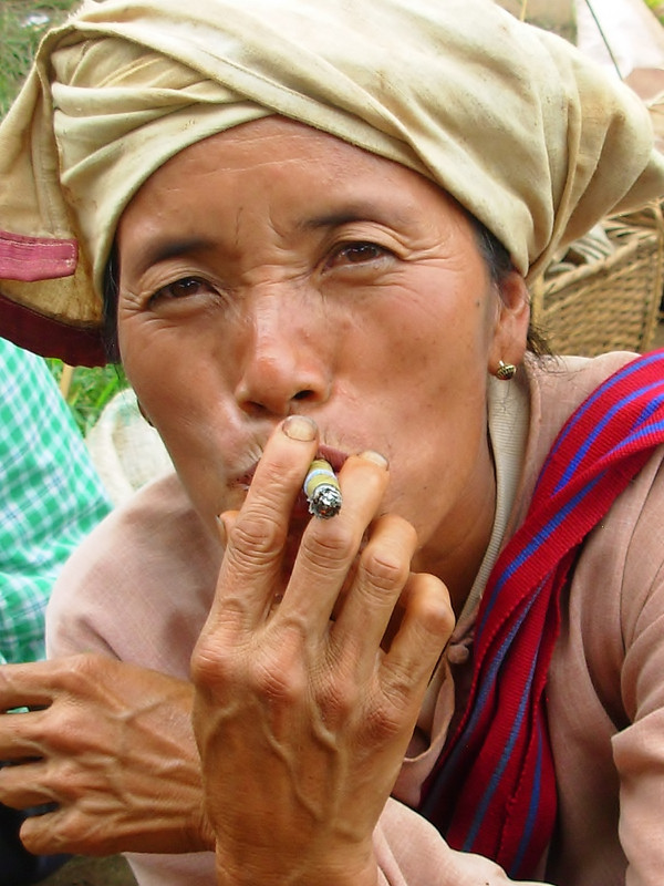 Cheroot smoker.  Inle lake, Myanmar,